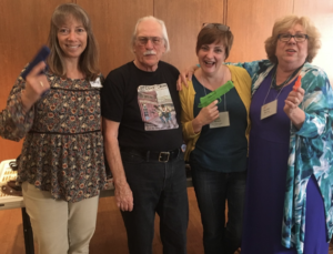 Photo of Jim Guili and three members of Sisters in Crime NorCal Chapter